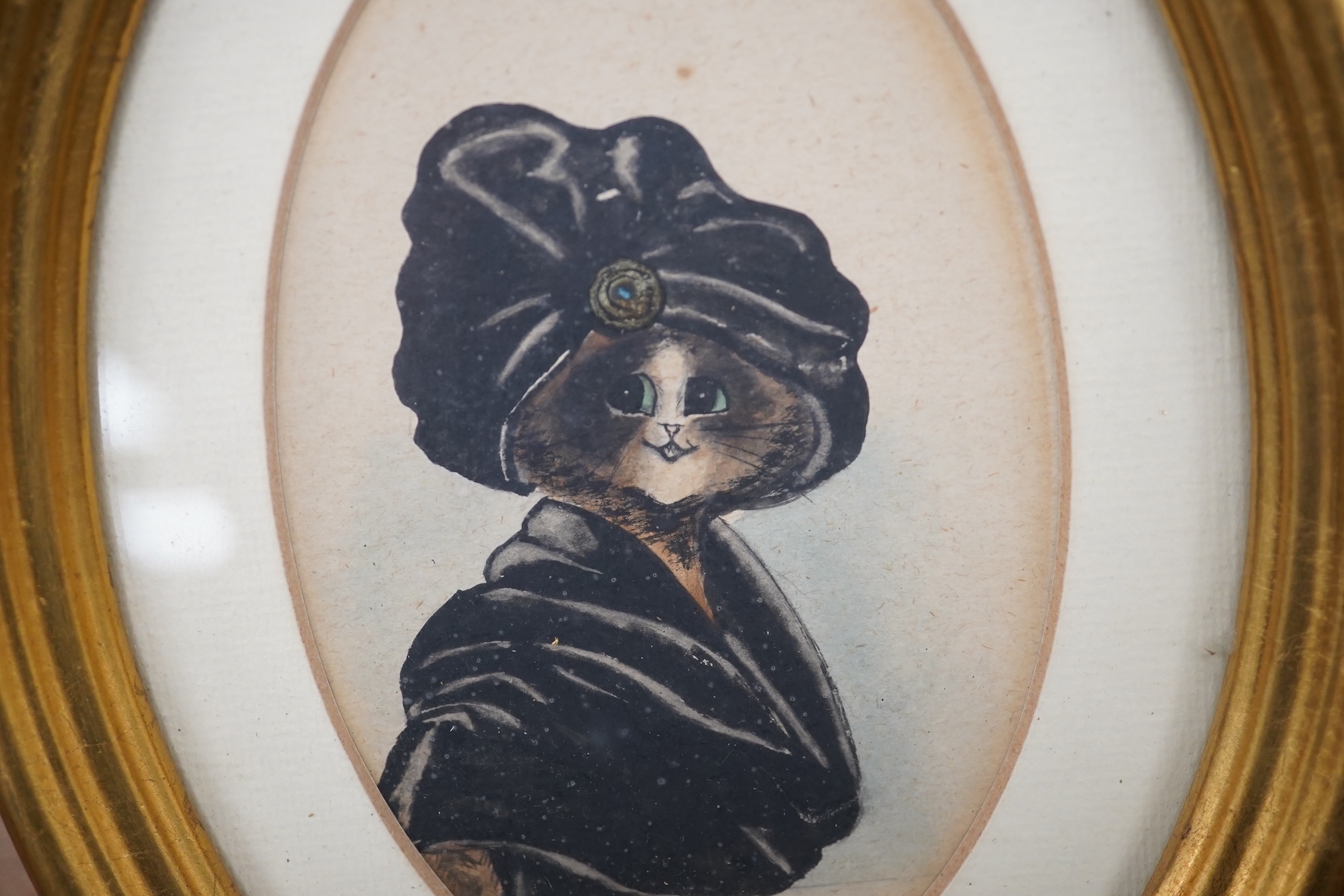 Style of Louis Wain (1860-1939), pair of oval watercolours, Comical studies of cats, 12 x 8.5cm, gilt framed. Condition - fair